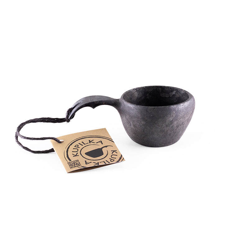 a coffee cup with a pair of scissors on it