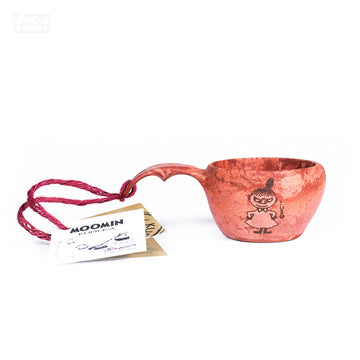 a pair of red scissors sitting on top of a table