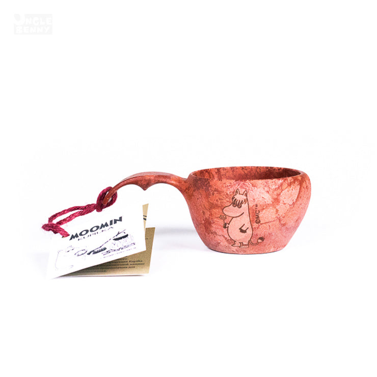 a close up of a hat on top of a book