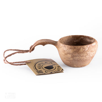 a cup of coffee and a pair of scissors