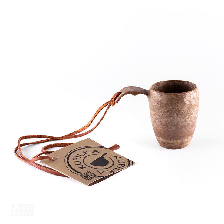 a coffee cup sitting on top of a table