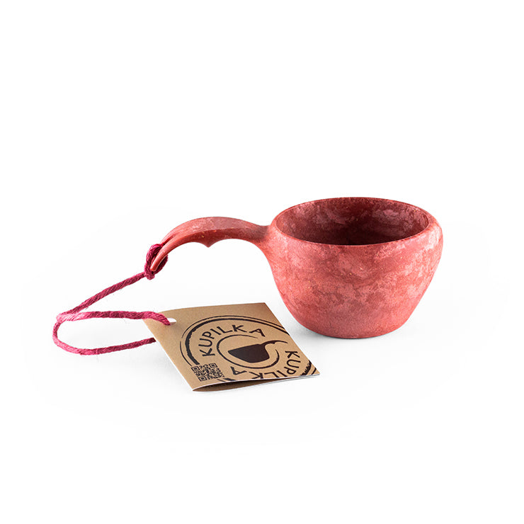 a coffee cup sitting on top of a table