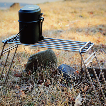 a close up of a small bird on a bench