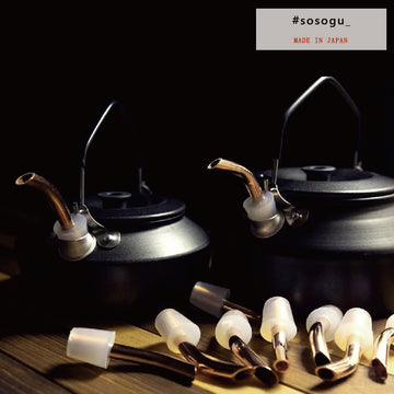 a stove top with pots and pans on top of it