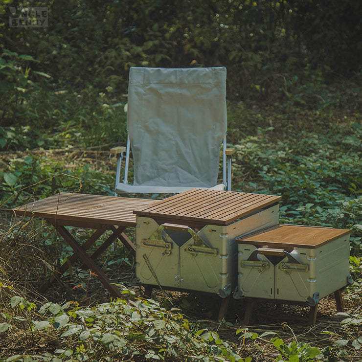 a wooden bench sitting in the middle of a forest 