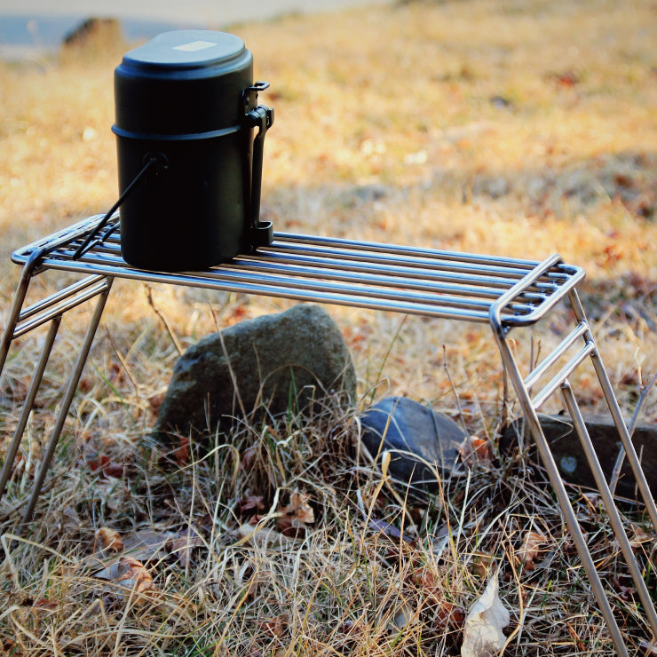 a close up of a small bird on a bench 